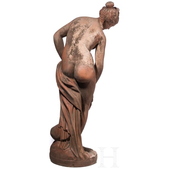 A German cast stone garden statue of a bathing nymph, 20th century