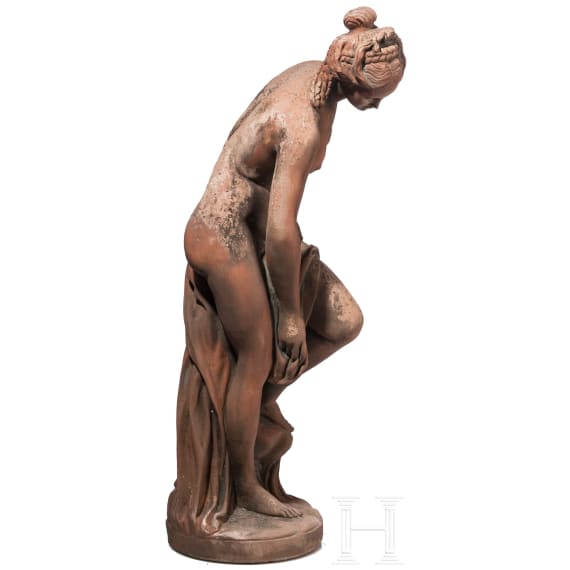 A German cast stone garden statue of a bathing nymph, 20th century