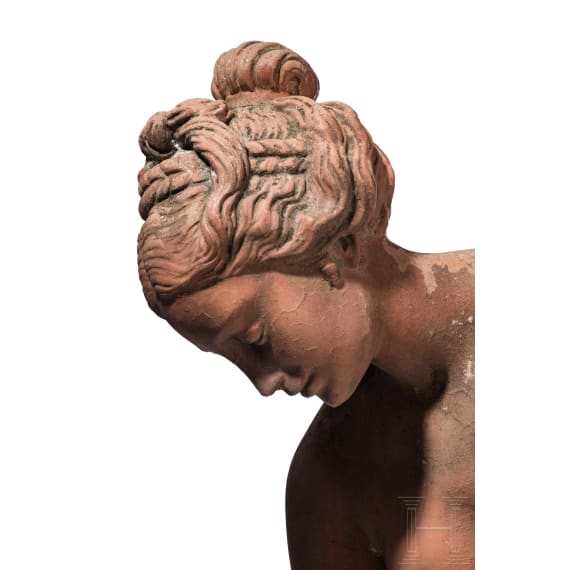 A German cast stone garden statue of a bathing nymph, 20th century