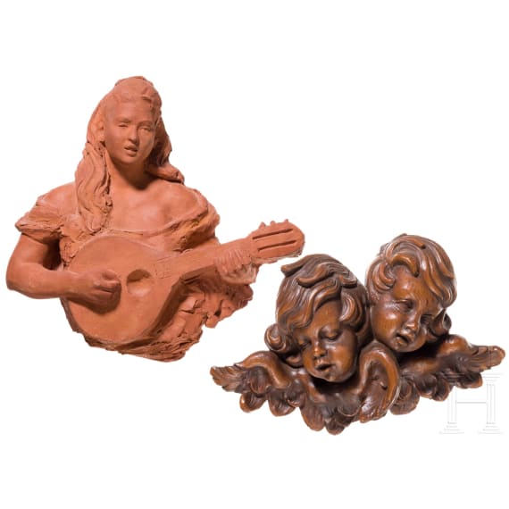 An Italian bozzetto of a lute player and carved angel heads, probably 19th century