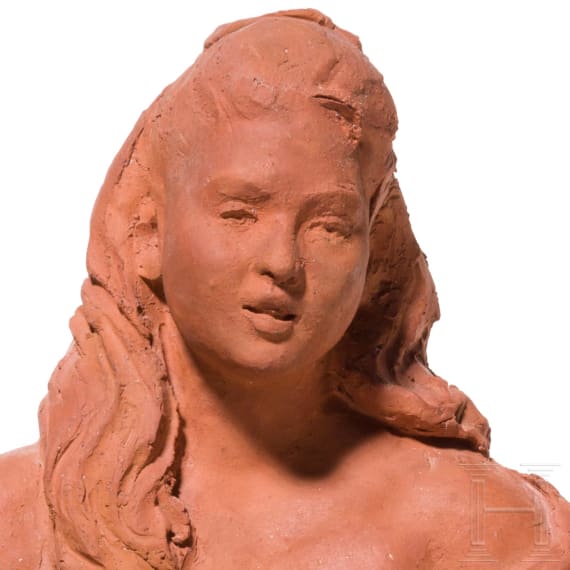 An Italian bozzetto of a lute player and carved angel heads, probably 19th century