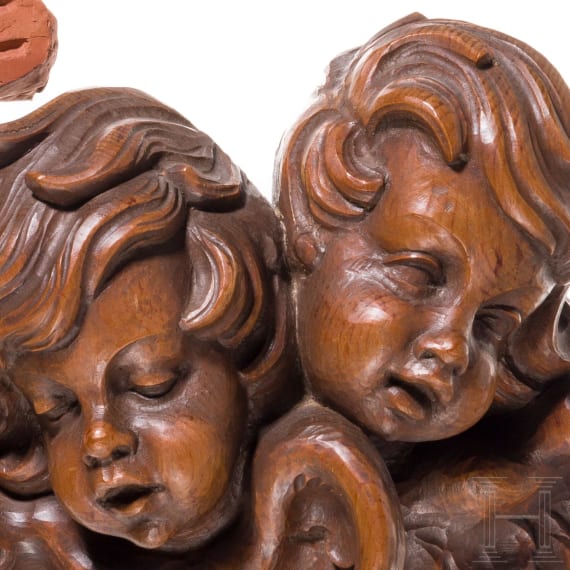 An Italian bozzetto of a lute player and carved angel heads, probably 19th century