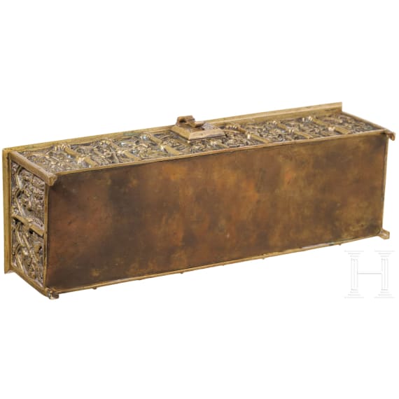 A brass casket showing saints, circa 1900