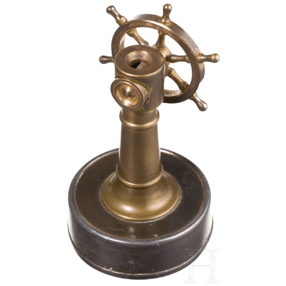A German brass steering wheel-shaped cigar cutter, circa 1900