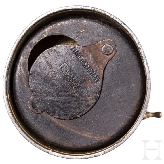 A German brass steering wheel-shaped cigar cutter, circa 1900