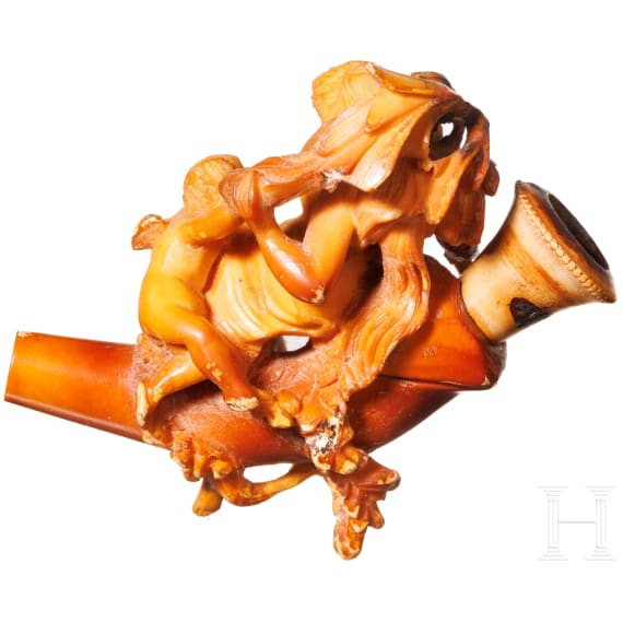 A carved meerschaum pipe with case