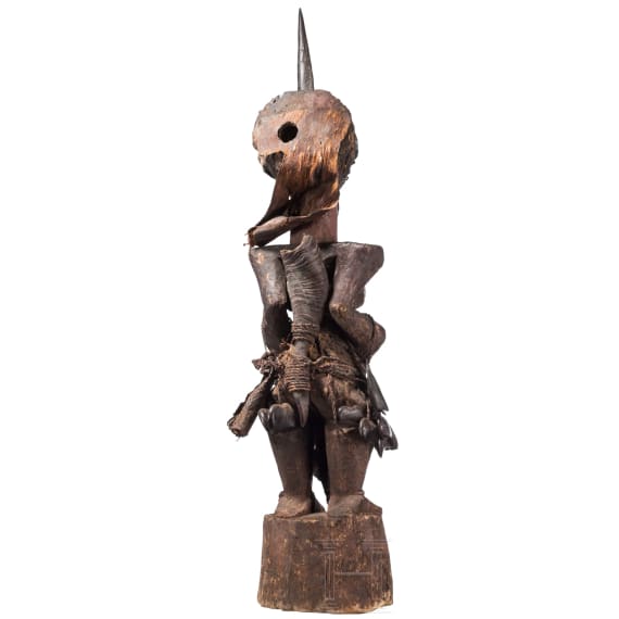 A Congolese Nkisi magic figure and a large Kifwebe mask of the Songye