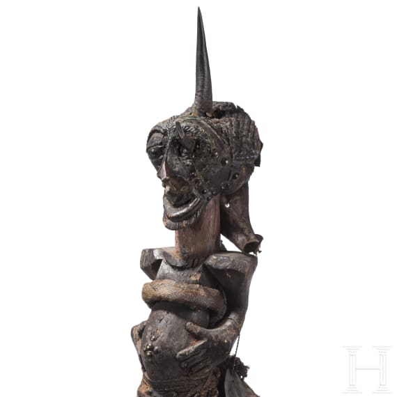A Congolese Nkisi magic figure and a large Kifwebe mask of the Songye