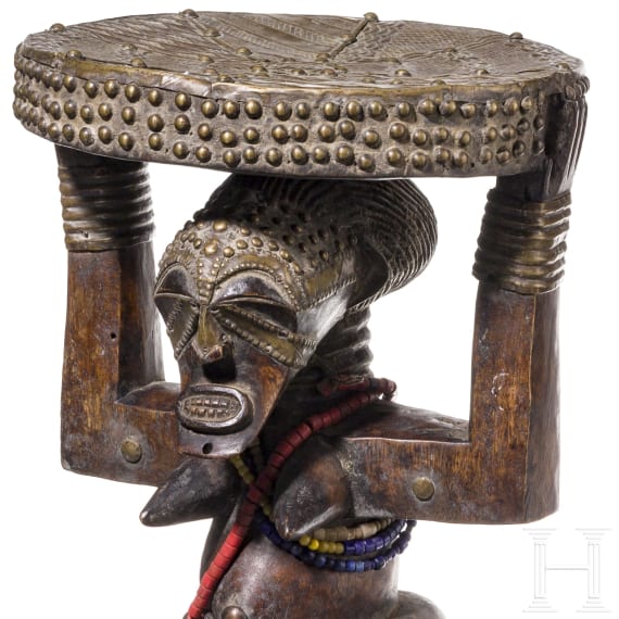 A Congolese caryatid stool and a kifwebe mask of the Songye people