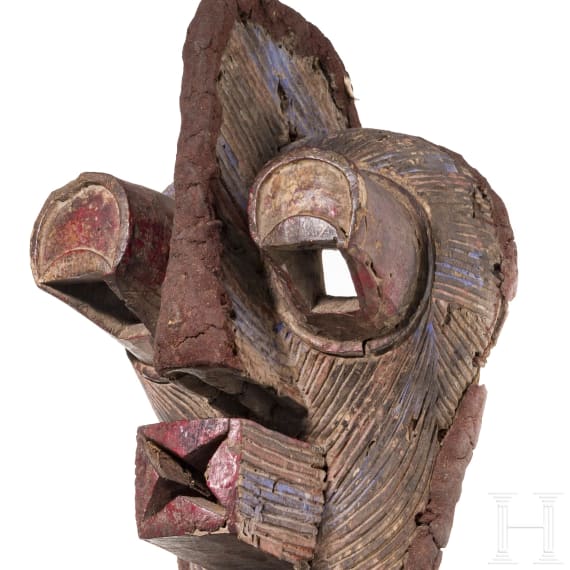 A Congolese caryatid stool and a kifwebe mask of the Songye people