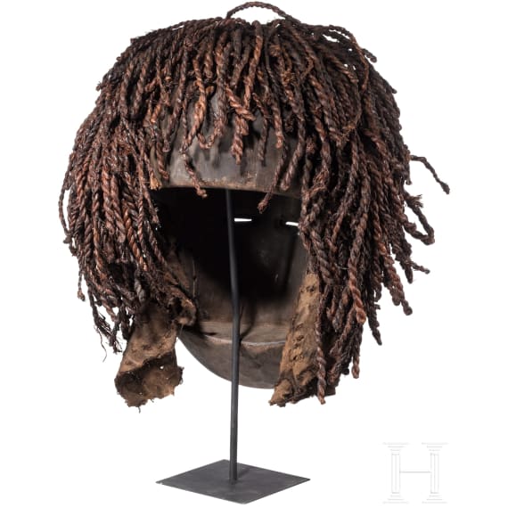 A Congolese cihongo mask of the Chokwe and a small Songye "fetish figure"