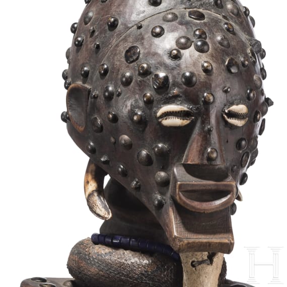 A Congolese cihongo mask of the Chokwe and a small Songye "fetish figure"