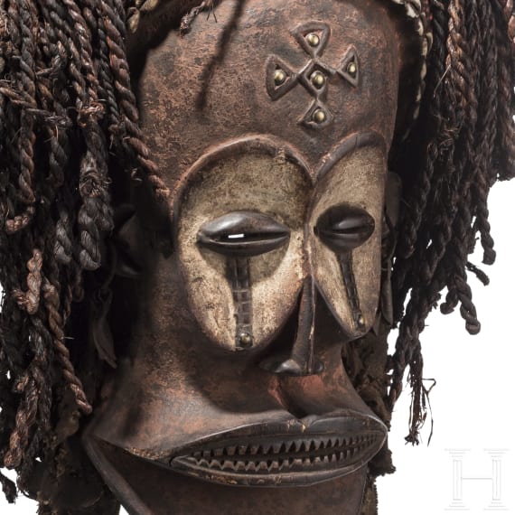 A Congolese cihongo mask of the Chokwe and a small Songye "fetish figure"