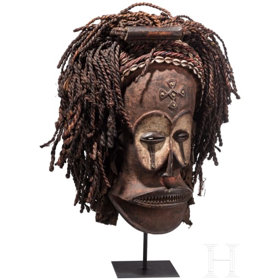 A Congolese cihongo mask of the Chokwe and a small Songye "fetish figure"