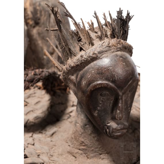 A Gabonese female figure of the Punu and a relic shrine of the Fang, 20th century