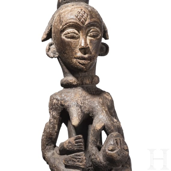 A Gabonese female figure of the Punu and a relic shrine of the Fang, 20th century