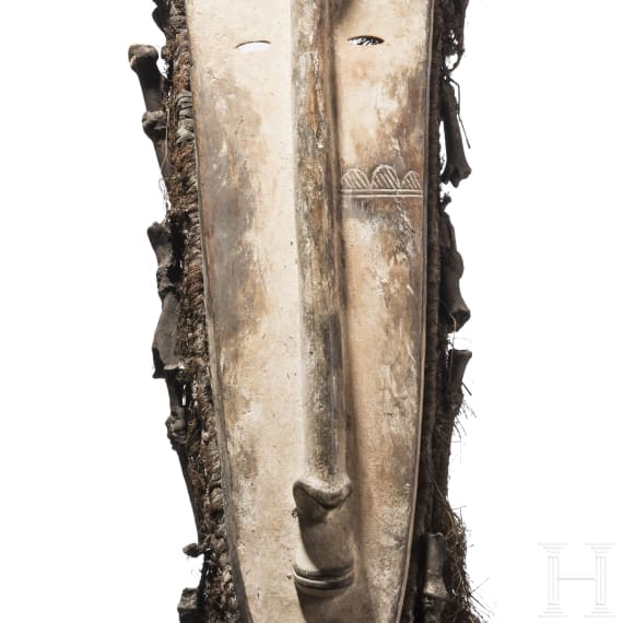 A Gabonese Fang mask and a Kenyan Maasai mask