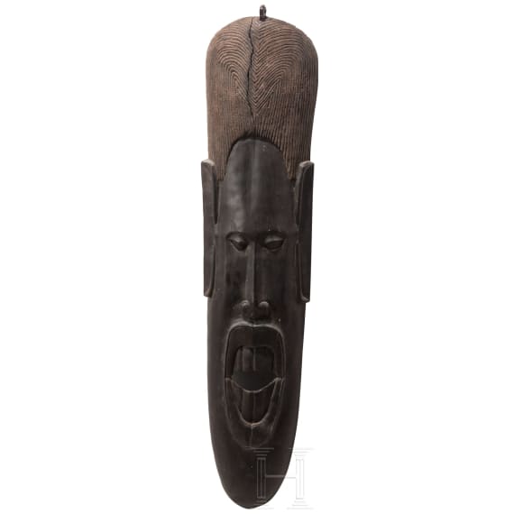 A Gabonese Fang mask and a Kenyan Maasai mask