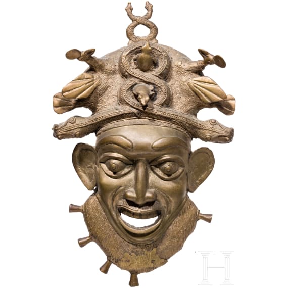 A heavy Cameroonian brass mask of the Bamum/Bamileke