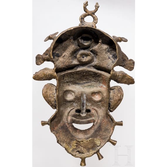 A heavy Cameroonian brass mask of the Bamum/Bamileke