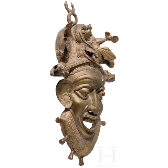 A heavy Cameroonian brass mask of the Bamum/Bamileke