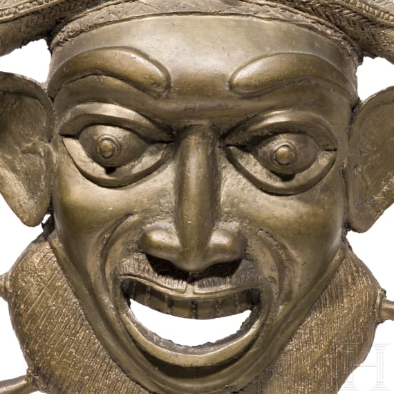 A heavy Cameroonian brass mask of the Bamum/Bamileke