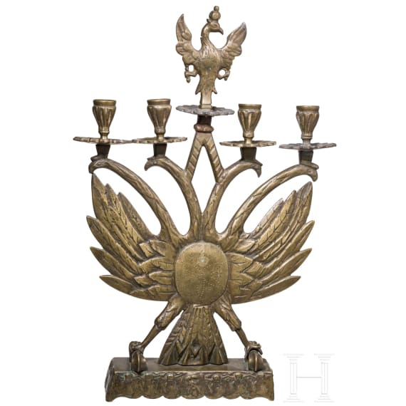 A four-light brass candelabra with double eagle, circa 1900