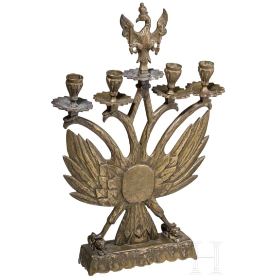 A four-light brass candelabra with double eagle, circa 1900