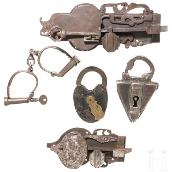 Two German iron door locks, two shackle locks and one handcuff, 17th/18th century