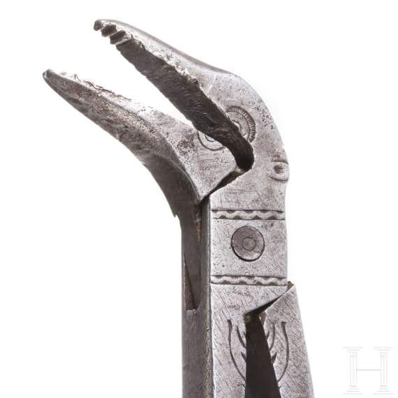 A pair of German engraved iron dental tongs, circa 1800