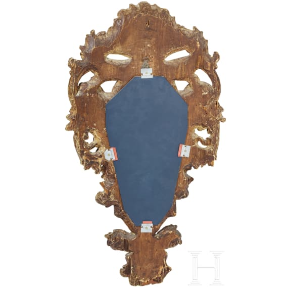 A mirror in a carved frame, probably German, 19th century