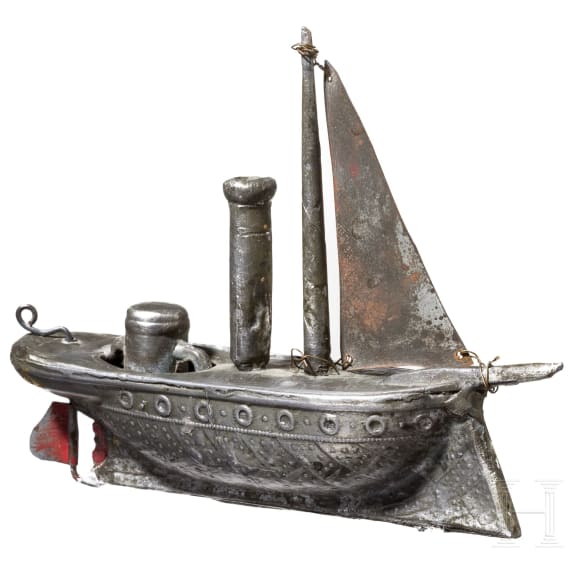 A pewter miniature sailing ship, circa 1840