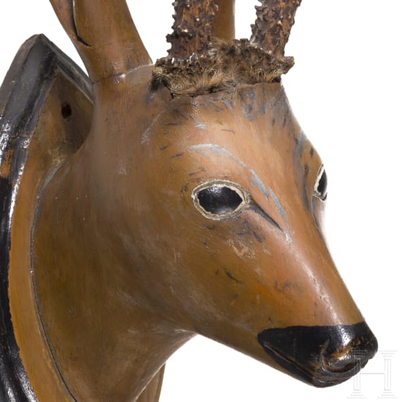 A German/Austrian roebuck trophy on a carved wooden head, circa 1800