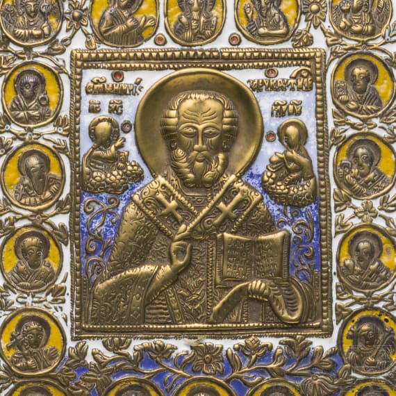 Two Russian enamelled bronze icons showing "Do not weep for me, Mother" and Saint Nicholas surrounded by prophets, 19th century