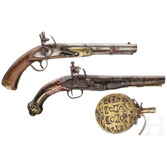 Two Moroccan flintlock pistols and a powder flask, 19th./20th century