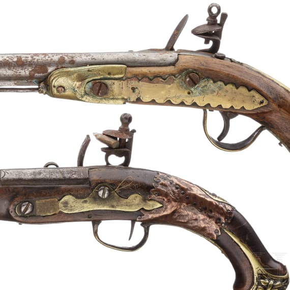 Two Moroccan flintlock pistols and a powder flask, 19th./20th century