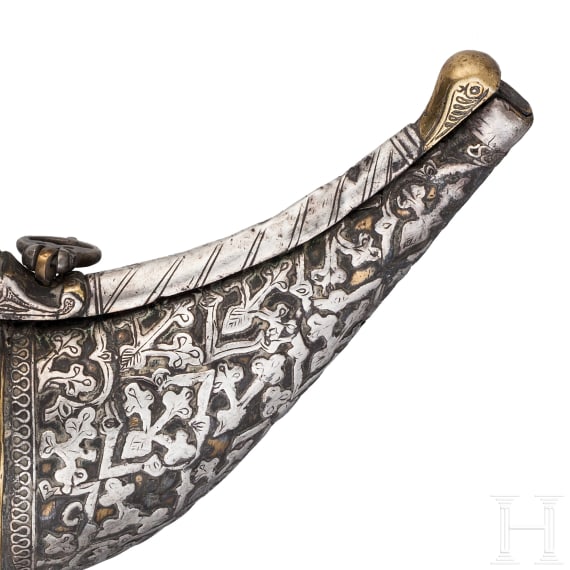 A silver decorated Indian powder flask, 19th century