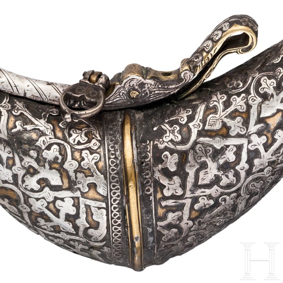 A silver decorated Indian powder flask, 19th century