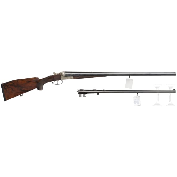 A side by side combination gun with extra side by side shotgun barrel in case