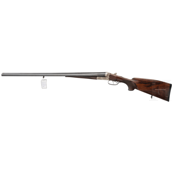 A side by side combination gun with extra side by side shotgun barrel in case