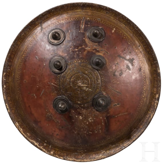 A painted Indian leather shield, circa 1800