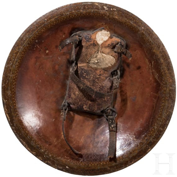 A painted Indian leather shield, circa 1800