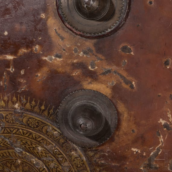 A painted Indian leather shield, circa 1800