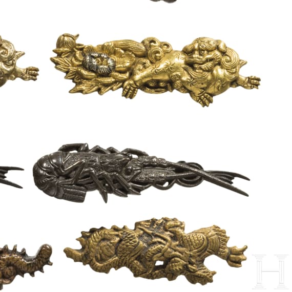 Three pairs of Japanese menuki, 19th and 20th century