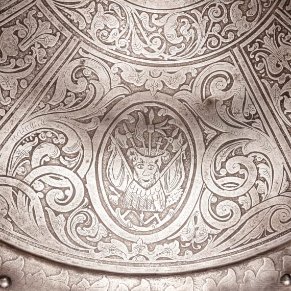 An etched round shield, collector's replica in the style of the 16th century