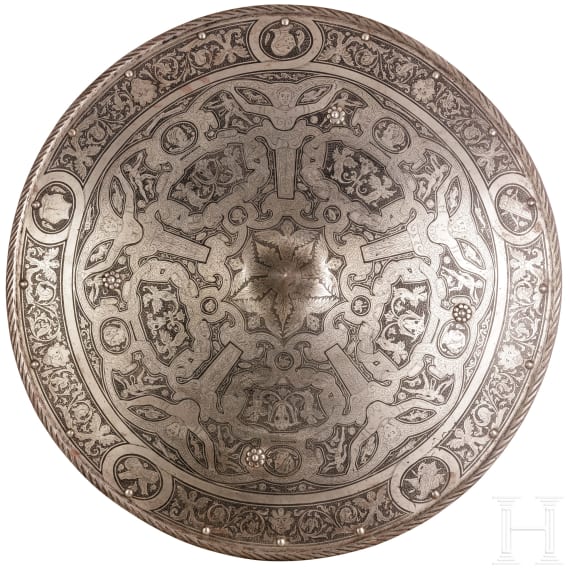 A heavy etched round shield, collector's replica in the style of the 16th century