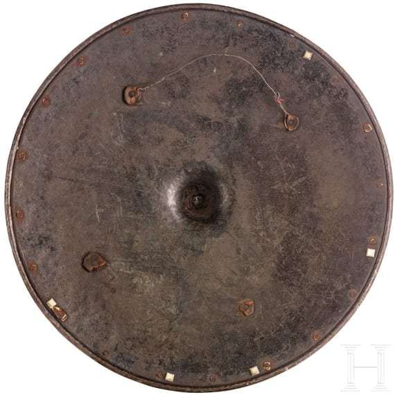 A heavy etched round shield, collector's replica in the style of the 16th century
