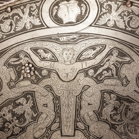 A heavy etched round shield, collector's replica in the style of the 16th century