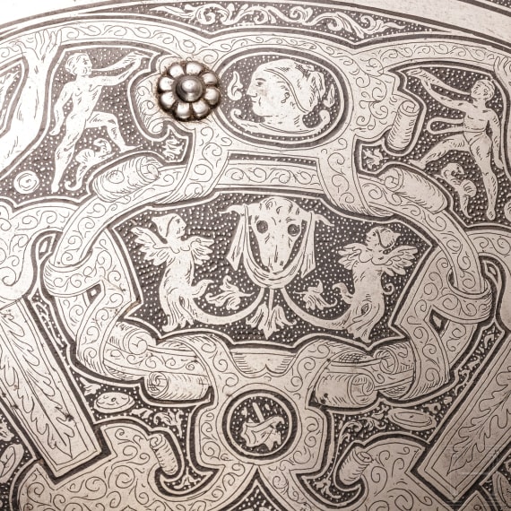 A heavy etched round shield, collector's replica in the style of the 16th century