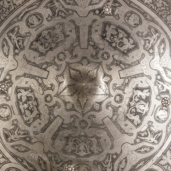 A heavy etched round shield, collector's replica in the style of the 16th century